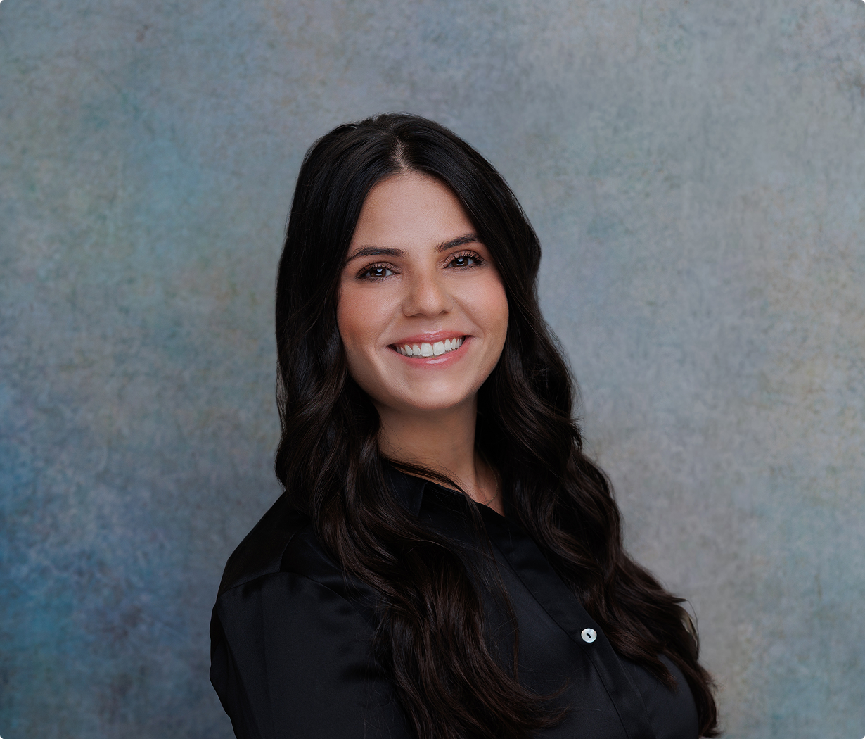 Smiling woman with long dark hair