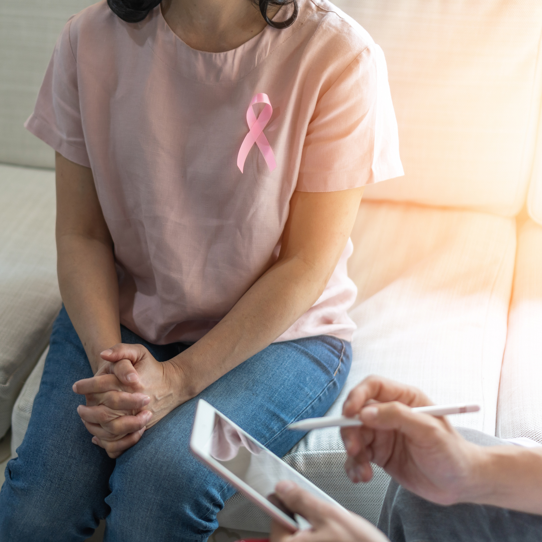 Patient discussing health with tablet in hand
