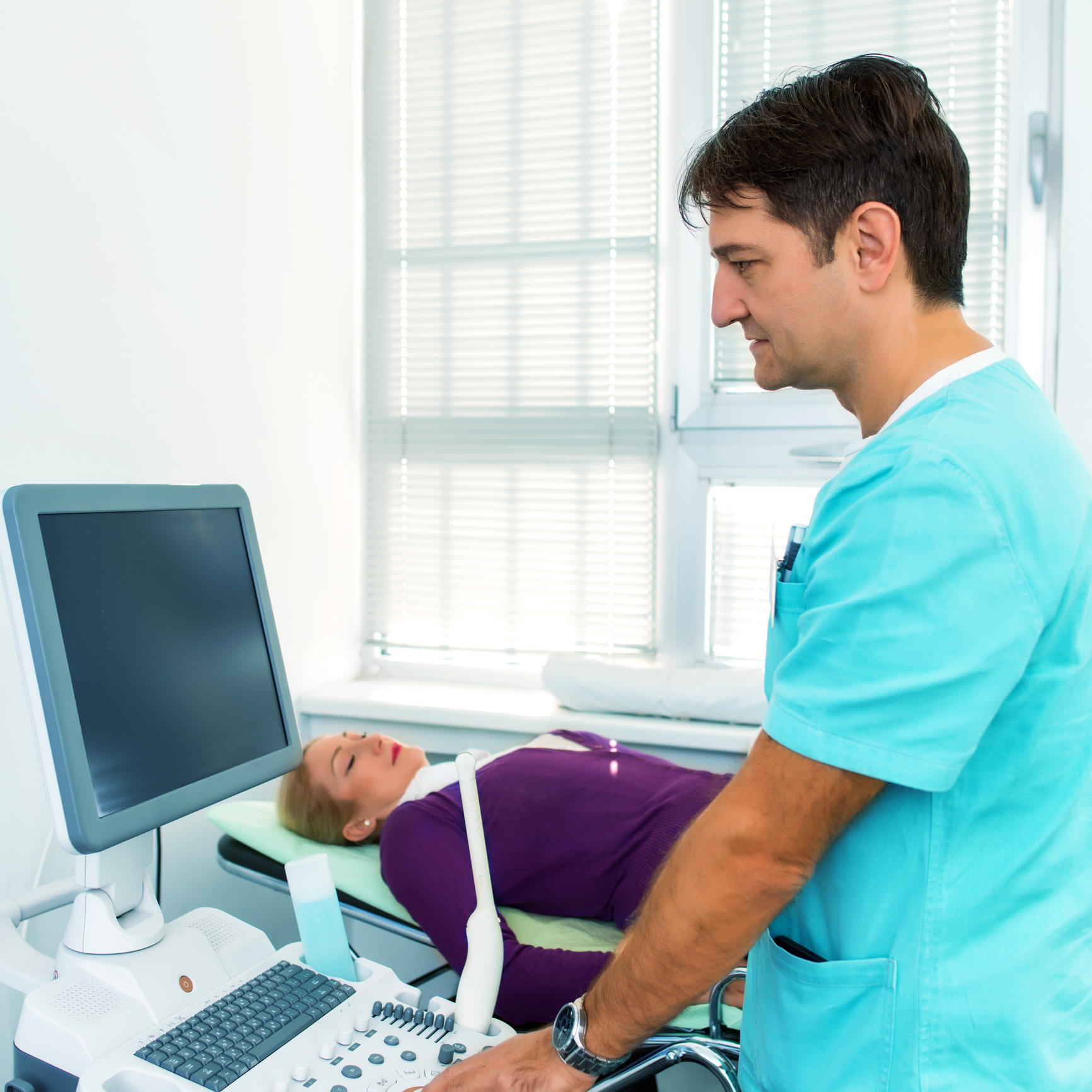 Medical professional conducting patient ultrasound