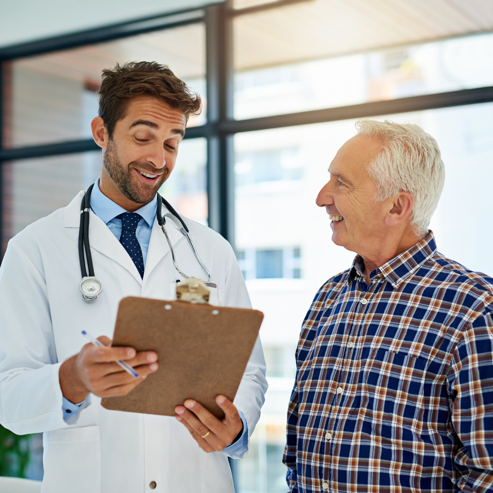 Doctor consulting with a smiling patient