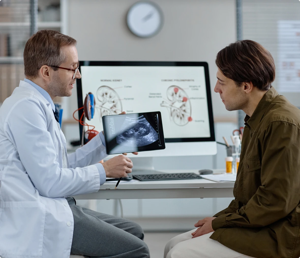 Doctor showing ultrasound to patient