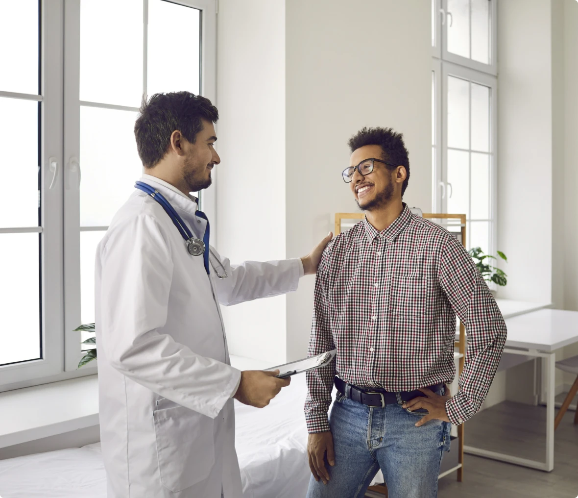 Friendly doctor with smiling patient