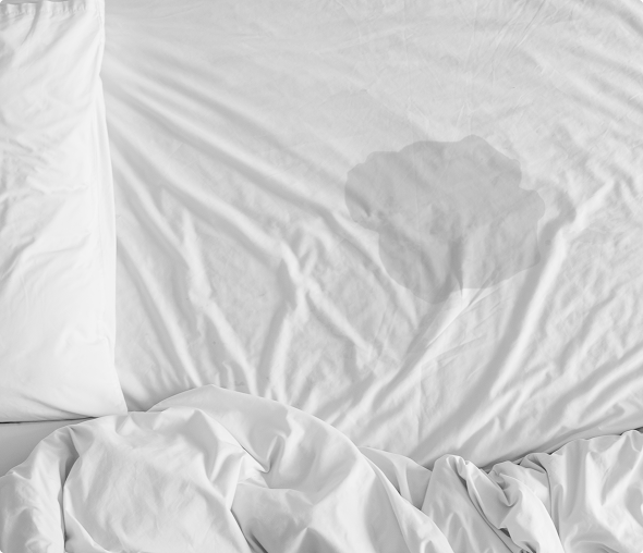 Stained white bed sheet and pillow