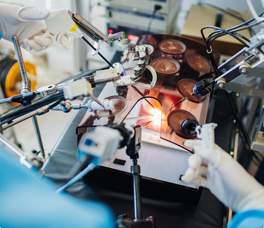 Surgeons operating with advanced robotic equipment