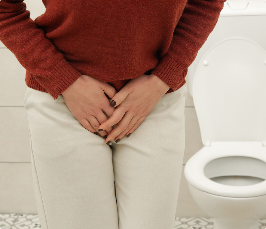 Individual experiencing urgency in restroom